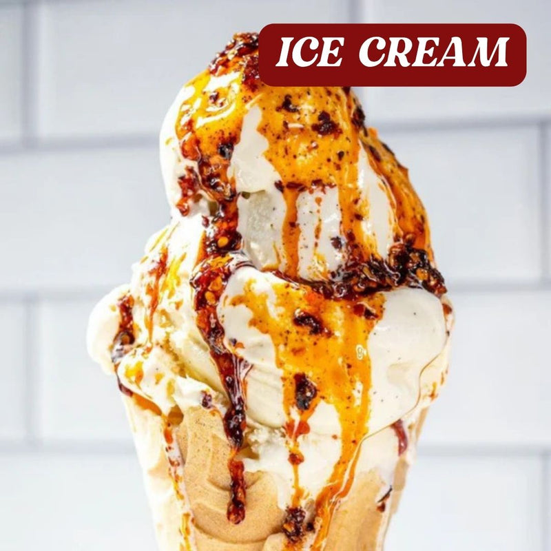 Ice cream cone with chilli oil drizzle on a white background