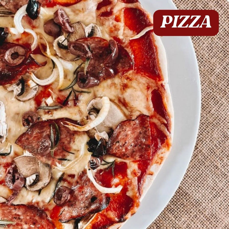 Close-up of a pizza with various toppings on a white plate, with 'PIZZA' text in red at the top.