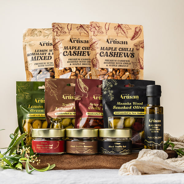 Assorted Artisan food products including nuts, infused olives, truffle olive oil and seasonings