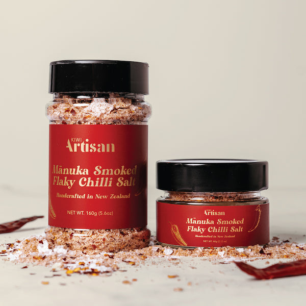 Two jars of Manuka Smoked Flaky Chilli Salt with red labels on a light background