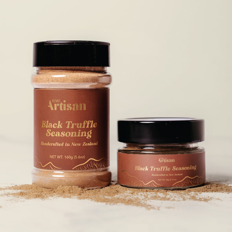 Two jars of Artisan Black Truffle Seasoning on a light background