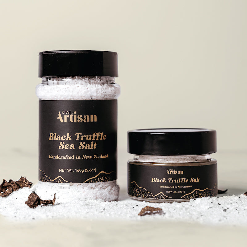 Two jars of Black Truffle Sea Salt by Kiwi Artisan on a light background