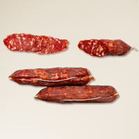 Four types of cured meats Salami on a beige background