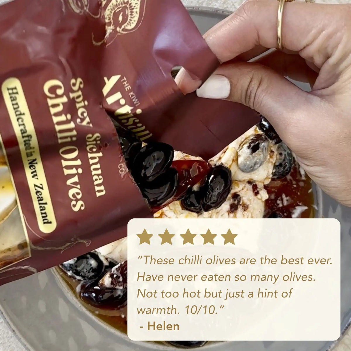 Hand holding a package of spicy Sichuan chilli olives with a five-star rating and review from Helen.