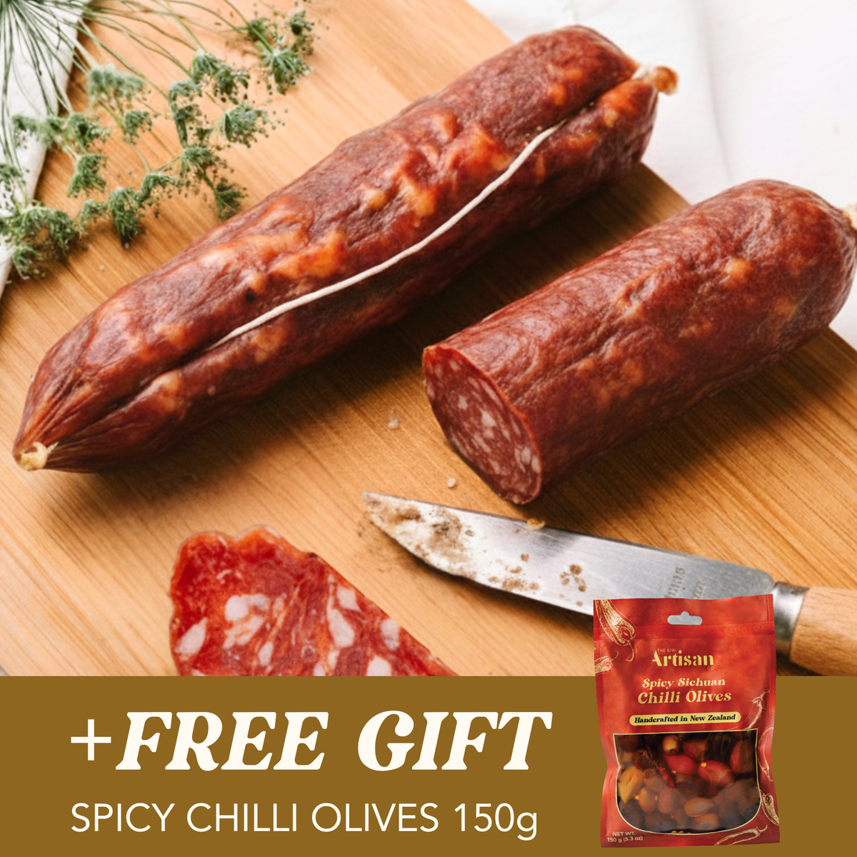 Two Artisan Salamis on a wooden cutting board with a knife and a package of spicy chili olives.