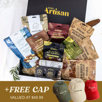 Kiwi Artisan gift box with various snacks and a promotional banner for free caps.
