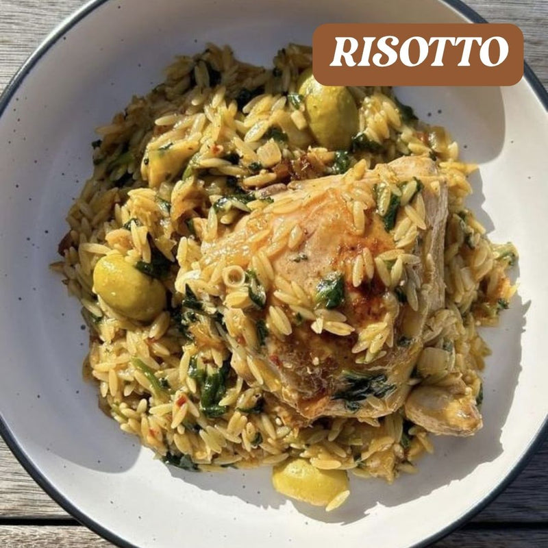 Risotto dish with chicken and lemon on a white plate, labeled 'RISOTTO'.