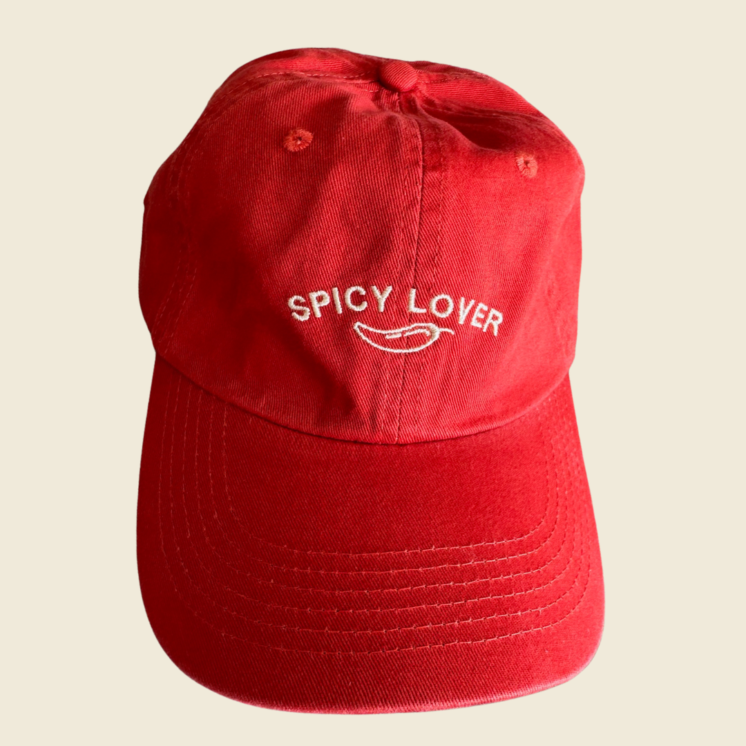 Orange-red cap with Spicy Lover print
