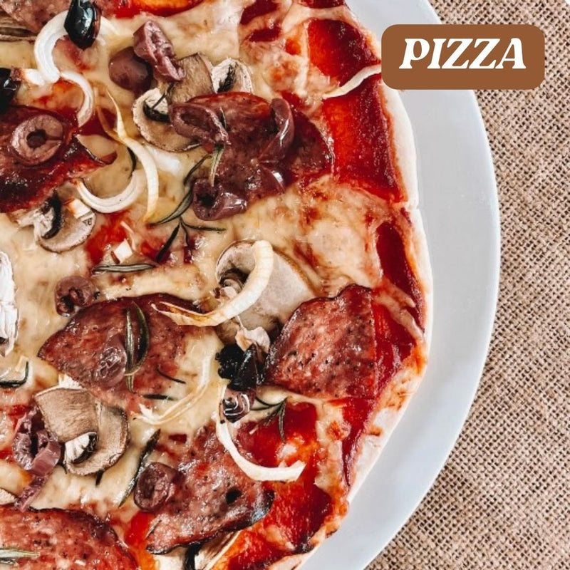 Close-up of a pizza with various toppings on a white plate, with 'PIZZA' text in a brown box.